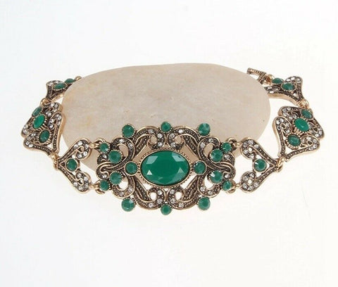 Antique gold plated Turkish Style bracelet 7.5 in with green resin stones