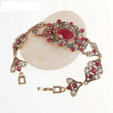 Antique gold plated Turkish Style bracelet 7.5 in with red resin stones